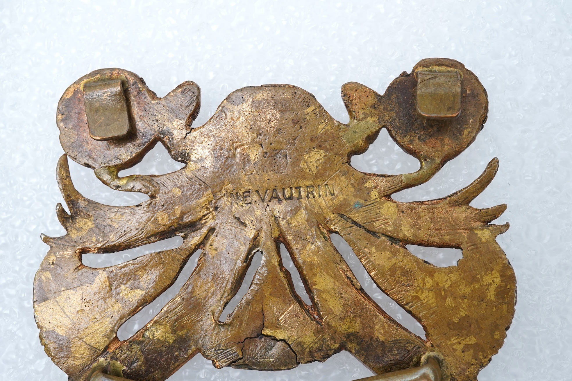 Line Vautrin, a gilt bronze belt buckle